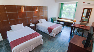 Deluxe room interior at Century Helang Hotel