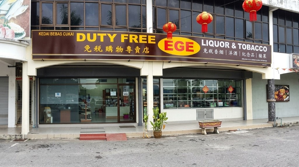 EGE Duty Free Liquor & Tobacco shopfront on Jalan Padang Matsirat with red lanterns