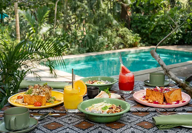 Pegaga Cafe poolside seating at Ambong Rainforest Retreat