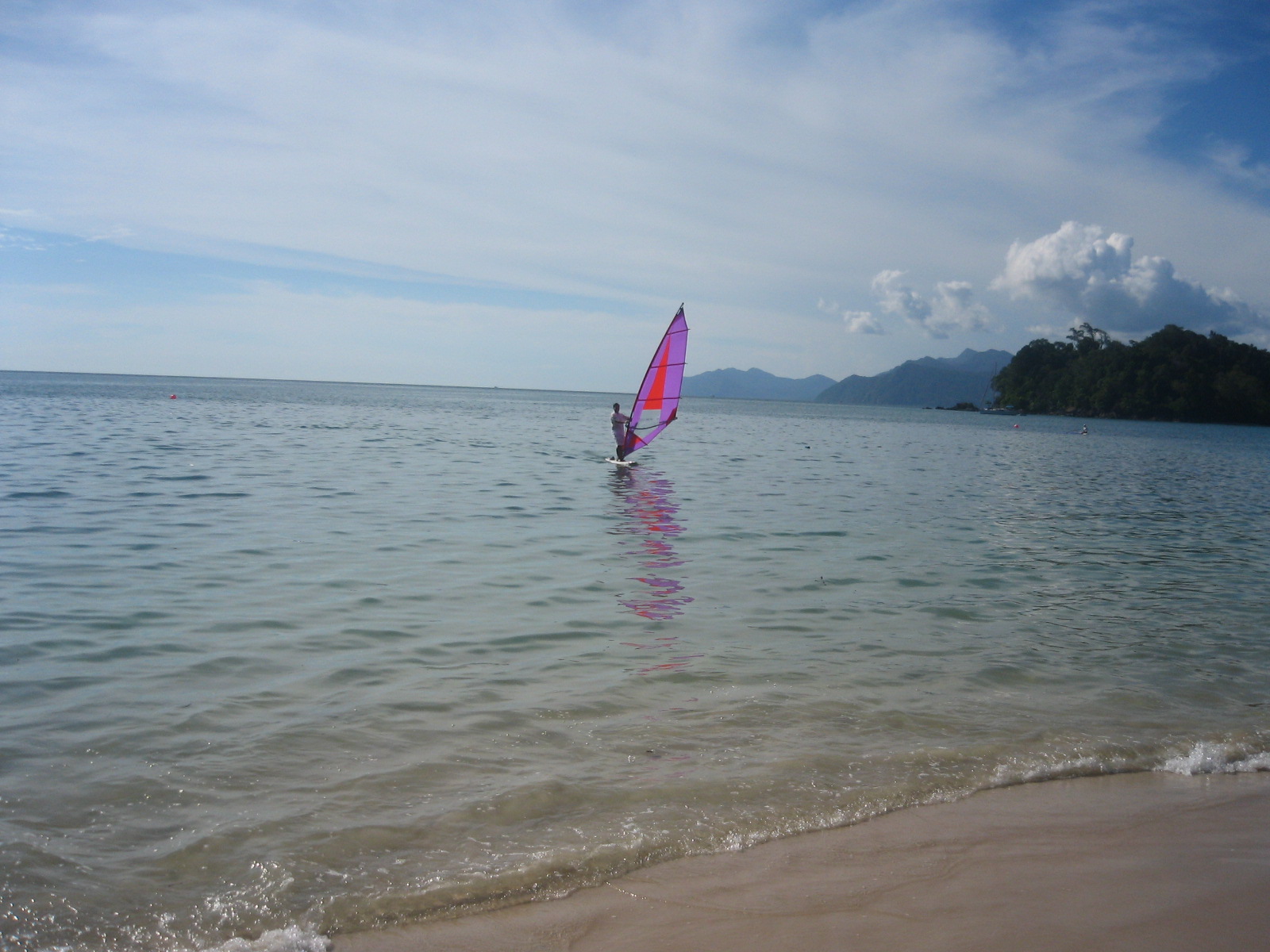 Rainforest-backed beach and calm bay at Teluk Datai Langkawi