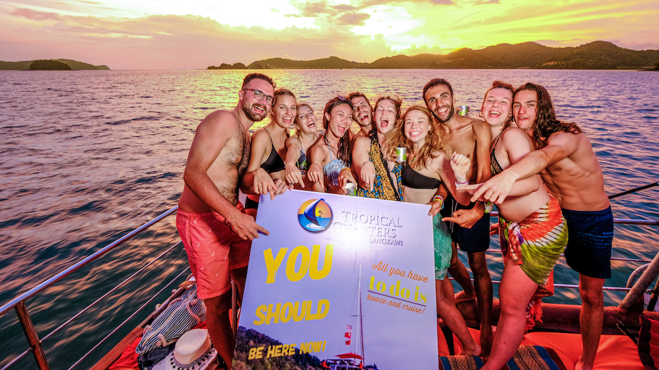 Guests on a Tropical Charters Langkawi sunset cruise deck